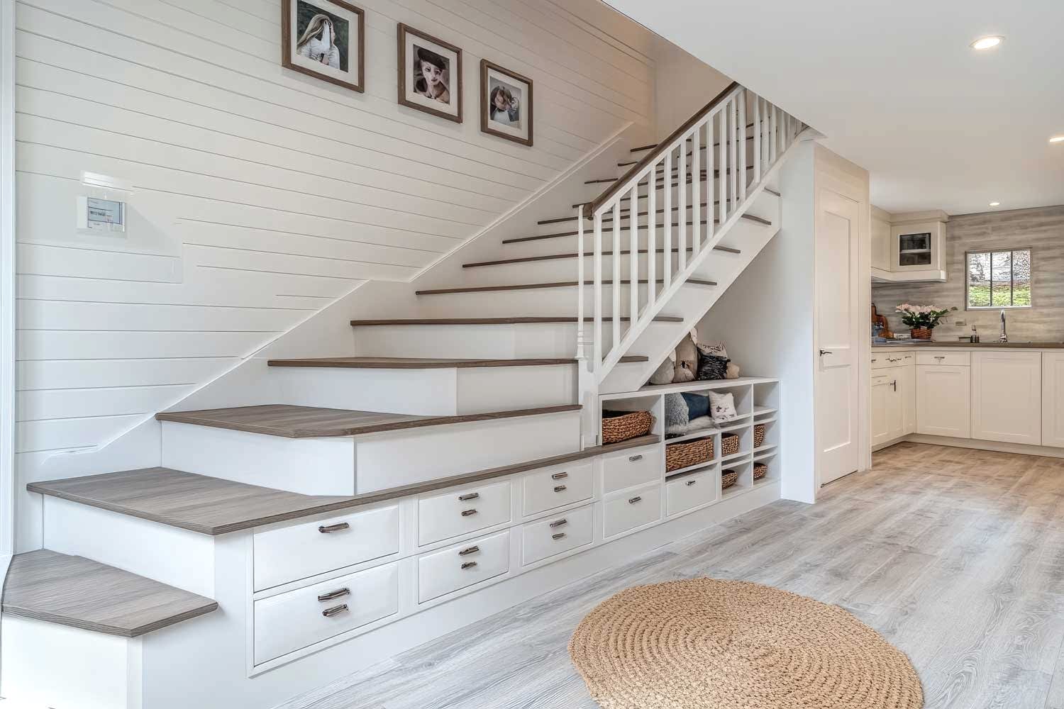 vecteezy_elegant-white-staircase-with-storage-drawers-in-new-luxury-home_51209836
