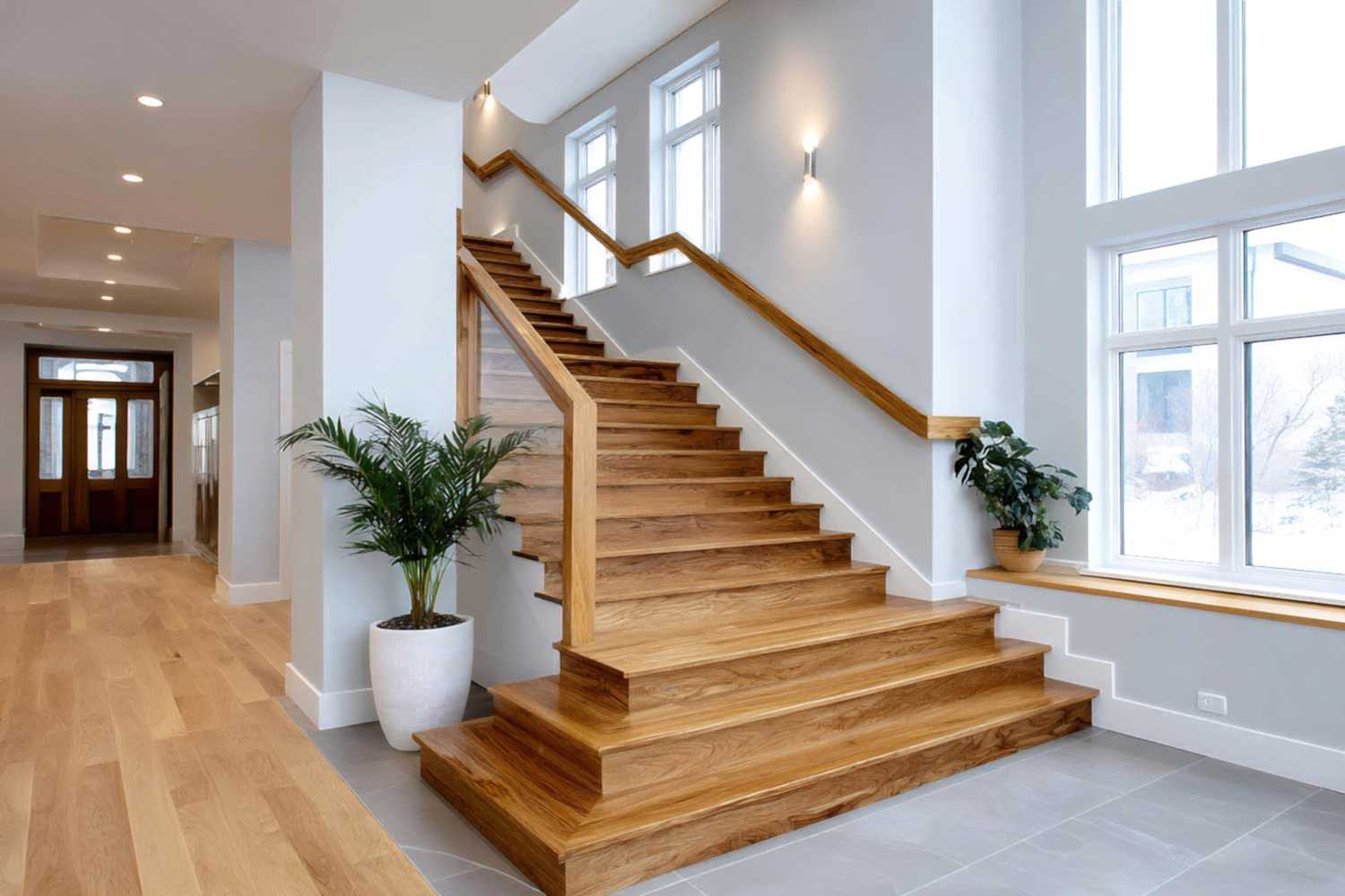 vecteezy_modern-home-interior-with-bright-wooden-staircase-and-large_73288214